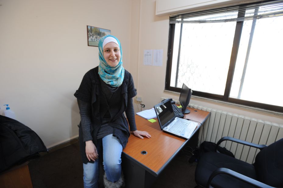 Hiba poses at the CARE urban refugee center where she volunteered.  "After working there, I have become more social, and no longer feel isolated. It's not like sitting at home, feeling powerless, losing confidence, wondering what I can do to help my family, to help my people.  Instead I feel empowered.  I recognize my potential." 