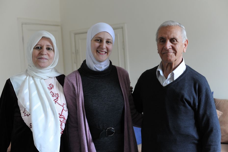 Hiba with her parents Salim and Hanan, in their apartment. Before he retired, Salim was an engineer and Hanan, a teacher.