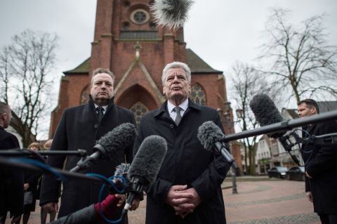 German President Joachim Gauck, alongside Haltern Mayor Bodo Klimpel, delivers a statement March 27 at a church in Haltern.