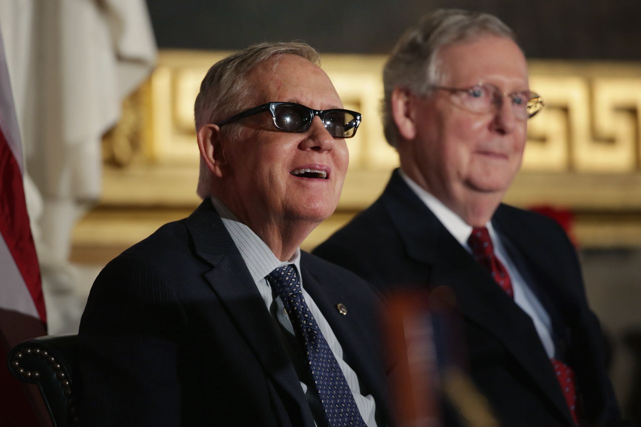 Reid and Senate Majority Leader Mitch McConnell, R-Kentucky, stand for the playing of the national anthem during Jack Nicklaus' Congressional Gold Medal ceremony in the U.S. Capitol Rotunda on March 24.