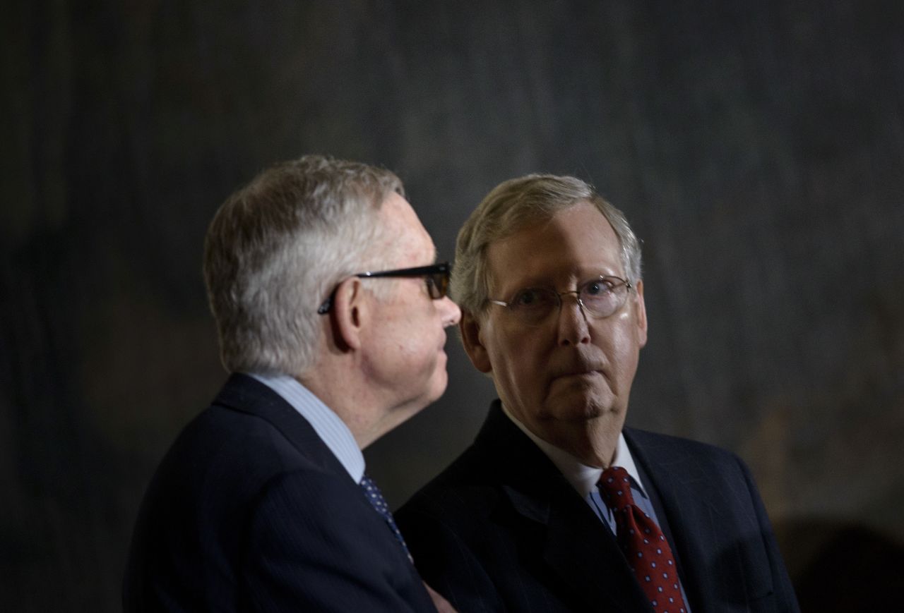 Reid and McConnell arrive for a Congressional Gold Medal ceremony.
