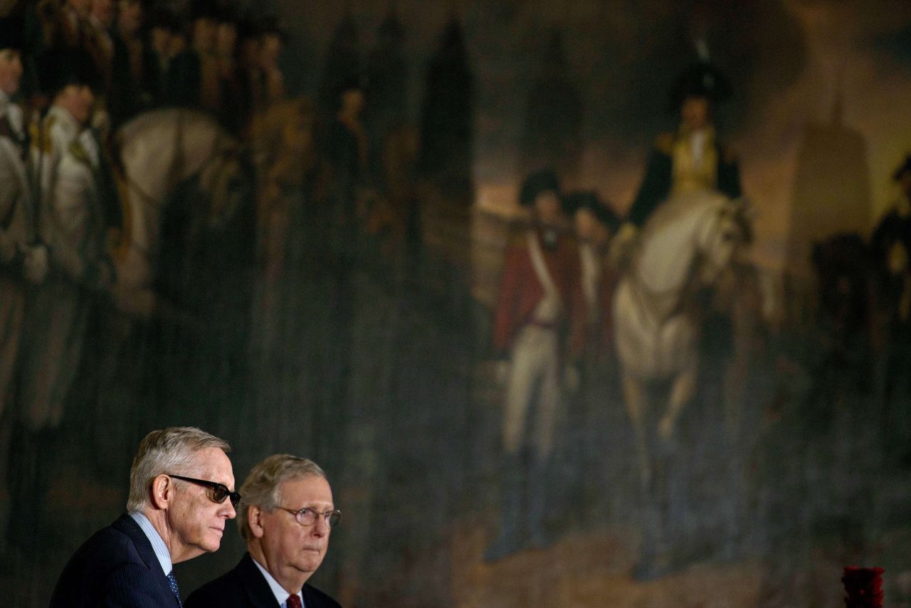 Reid and McConnell listen during a Congressional Gold Medal ceremony on Capitol Hill.