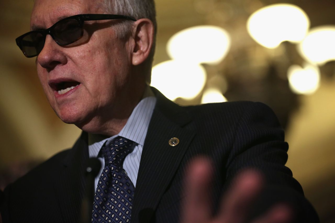 Reid speaks to members of the media after the weekly Democratic Policy Luncheon March 24 at the U.S. Capitol.