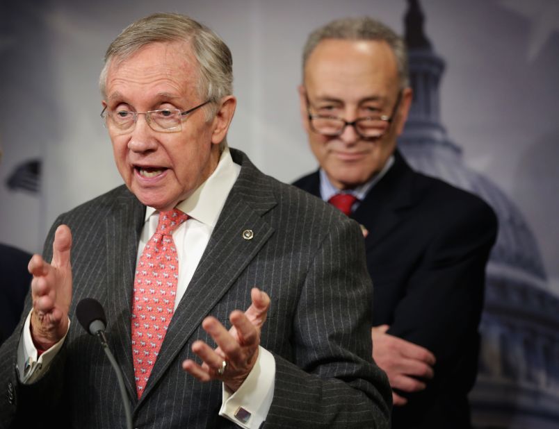 Reid speaks as Sen. Charles Schumer, D-New York,  listens during a news conference March 26, 2014. Reid endorsed Schumer to succeed him as minority leader.