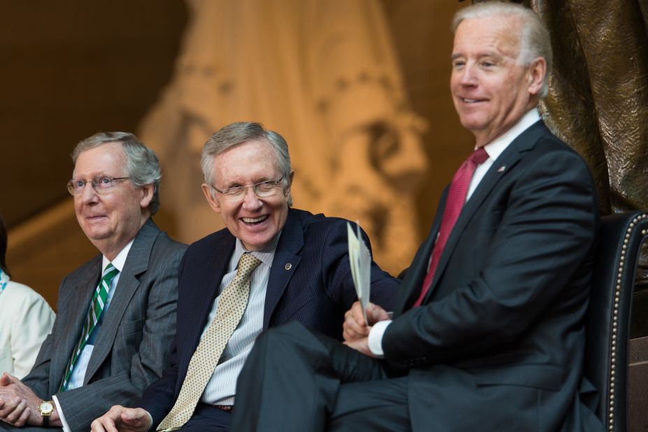 Reid, center, shares a laugh with Senate Minority Leader Mitch McConnell, left, and Vice President Joe Biden in 2013. They were attending the dedication ceremony for a new Frederick Douglass statue at the Capitol Visitor Center.