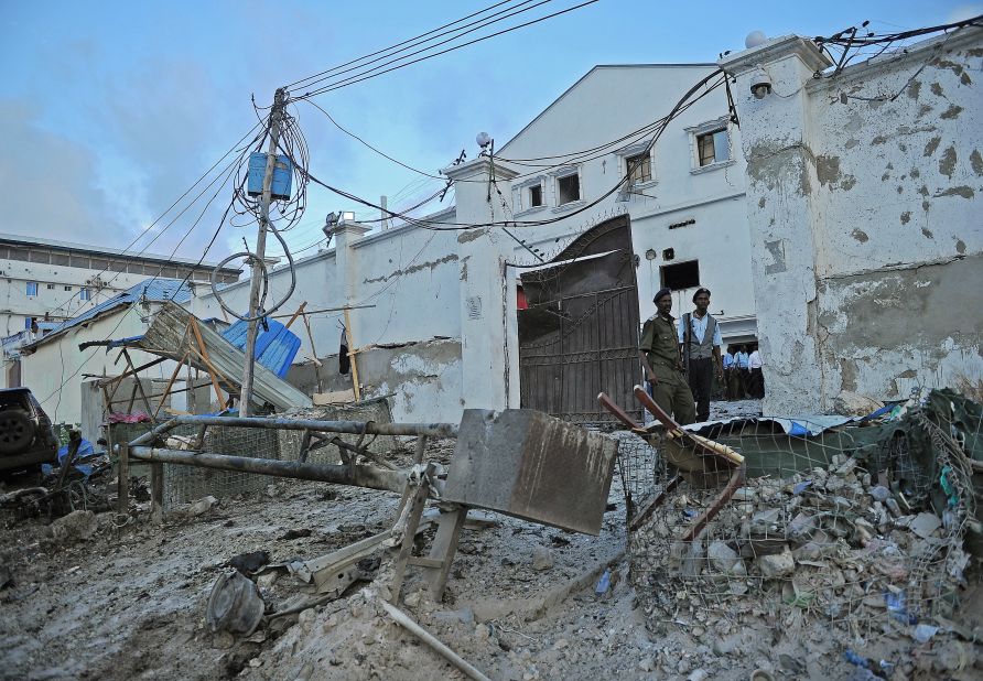 Security guards stand at the Makka Al Mukarama hotel, which was the site of a car bomb and gunbattle Friday, March 27, in Mogadishu, Somalia. Islamist militant group Al-Shabaab claimed responsibility for the deadly attack.