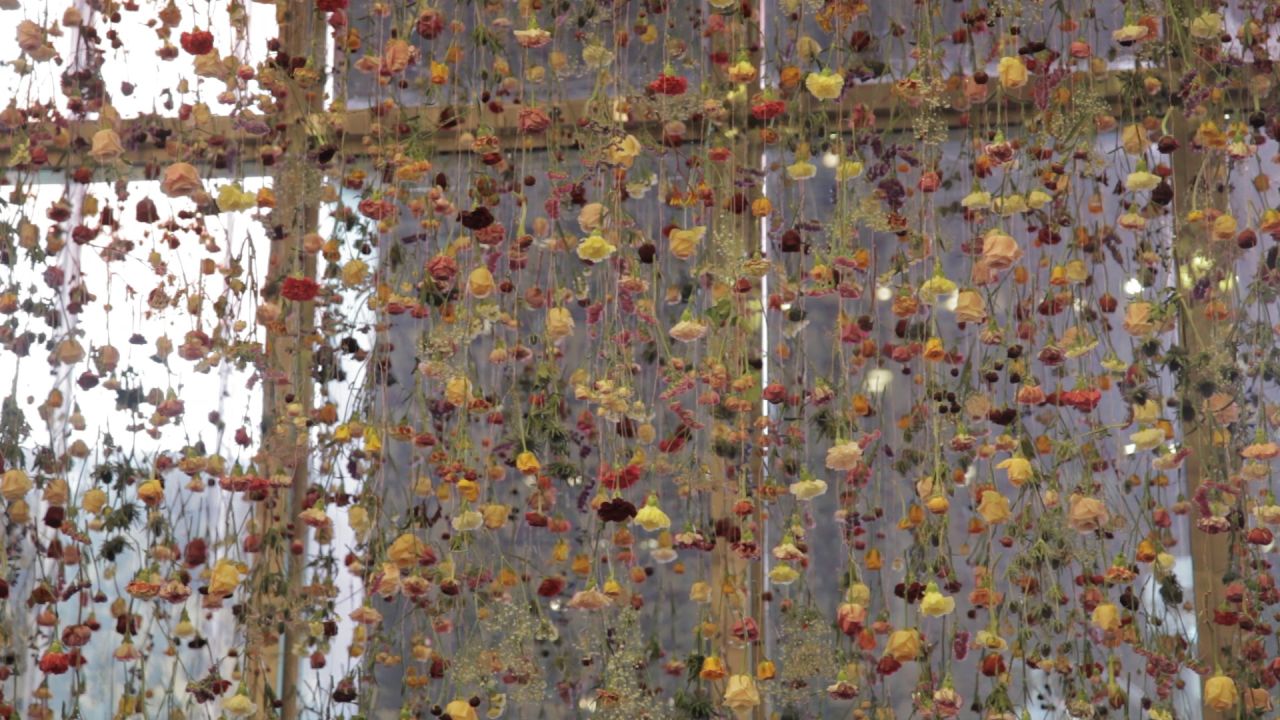 London flower artist <a href="http://www.rebeccalouiselaw.com/" target="_blank" target="_blank">Rebecca Louise Law</a> has created a dying -- and drying -- installation from 16,000 cut flowers that will cross the mortal boundary above the heads of visitors to a Times Square building, transforming from living organism to potpourri over a week.