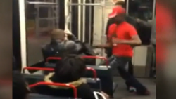 Man attacks a passenger after asking question about Mike Brown. 