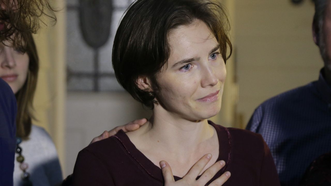 Amanda Knox talks to reporters outside her mother's home, Friday, March 27, 2015, in Seattle. Earlier in the day, Italy's highest court overturned the murder conviction against Knox and her ex-boyfriend over the 2007 slaying of Knox's roommate in Italy. (AP Photo/Ted S. Warren)