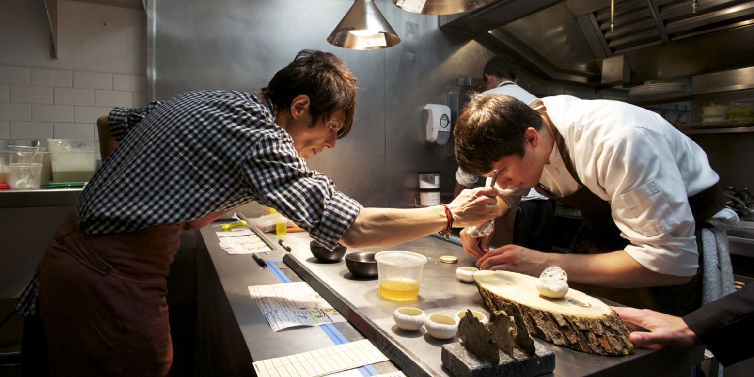 In the Atelier Crenn kitchen, Crenn fusses over every detail, as in this photo, plating uni. 