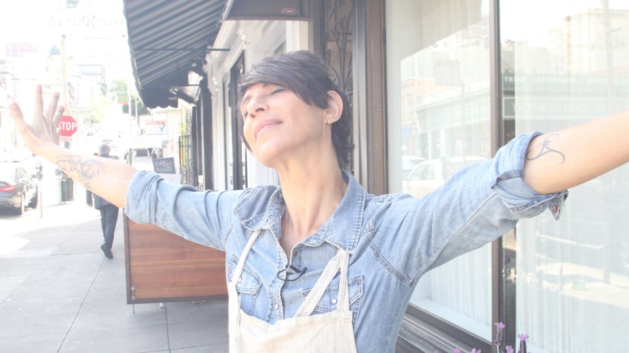 "Anything can happen, we might not be here tomorrow," says Crenn, here outside her San Francisco restaurant. "You have to enjoy life."