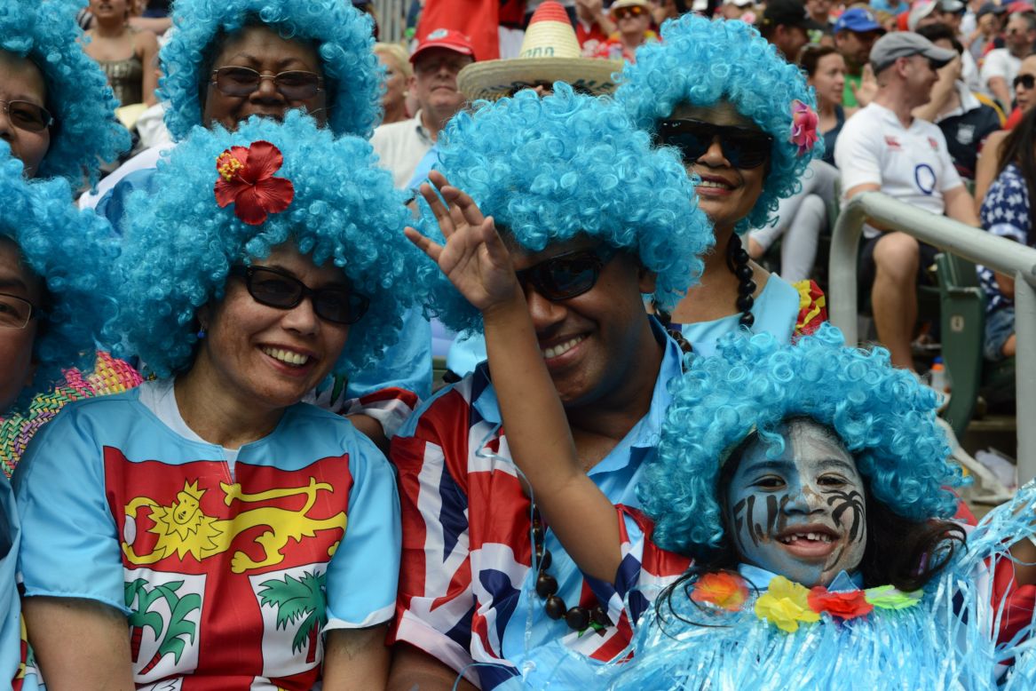 Fiji fans cheer on rugby players from the spectator stands.