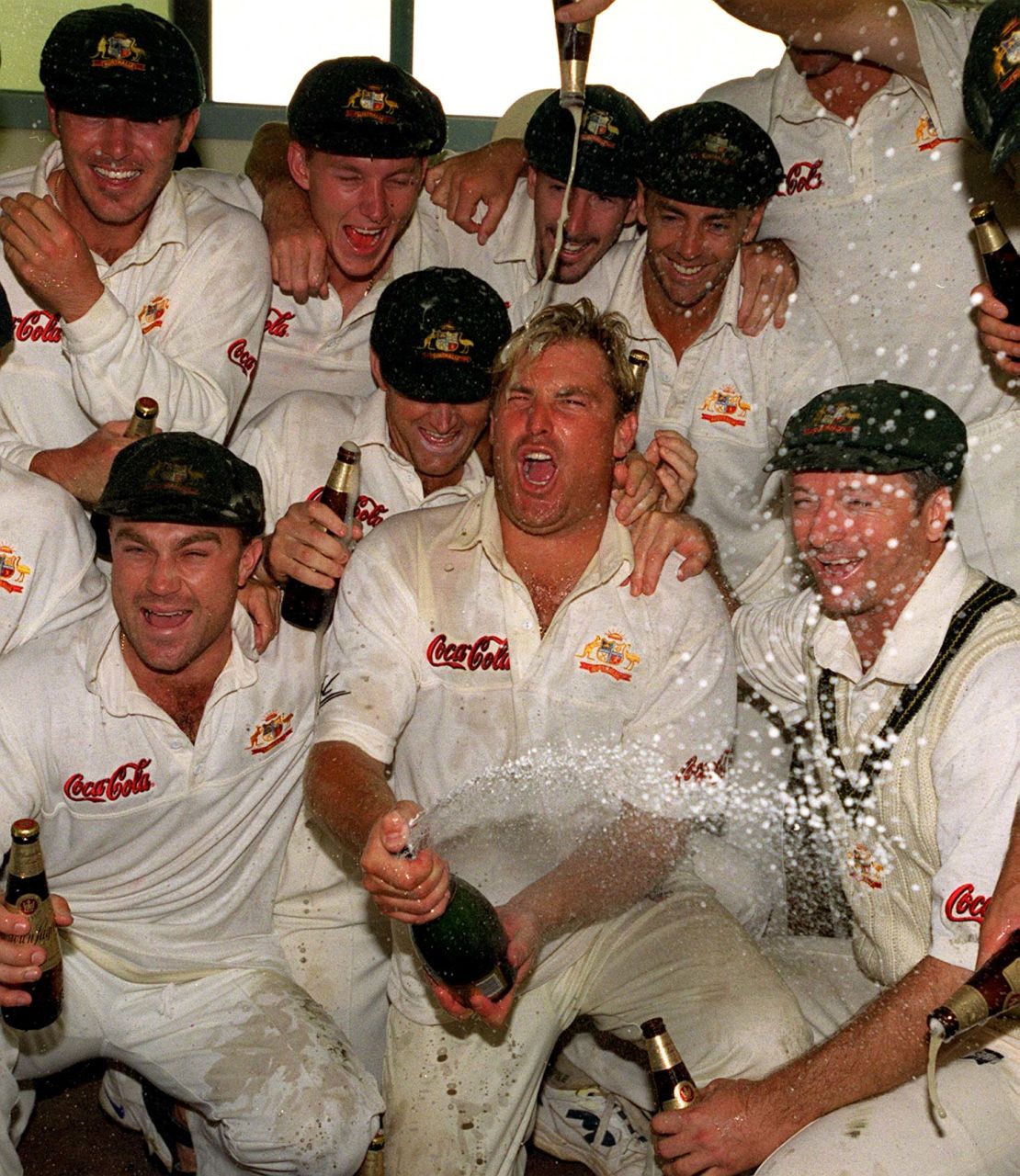 Australian cricketing legend Shane Warne, center, celebrates a win in New Zealand in 2000.
