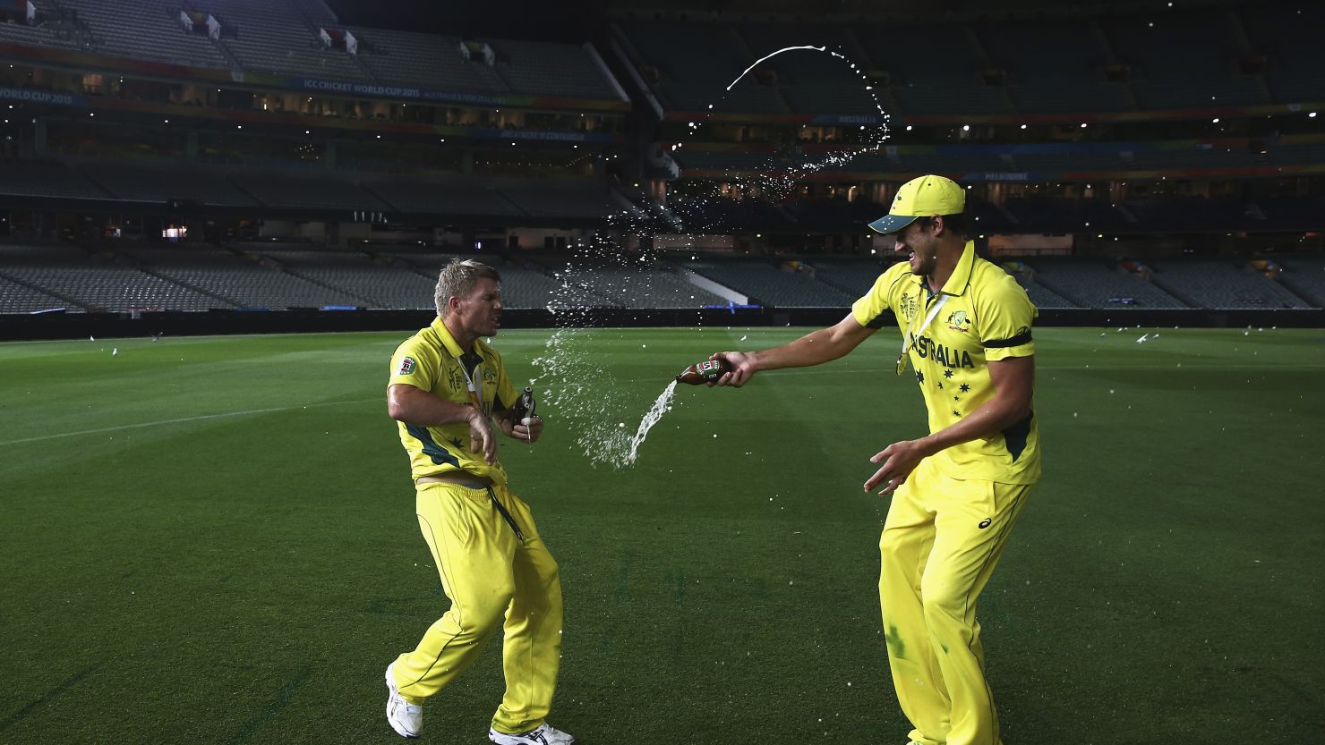 Australian cricketer Mitchell Starc douses teammate David Warner in beer in early morning celebrations at the Melbourne Cricket Ground after their World Cup victory.