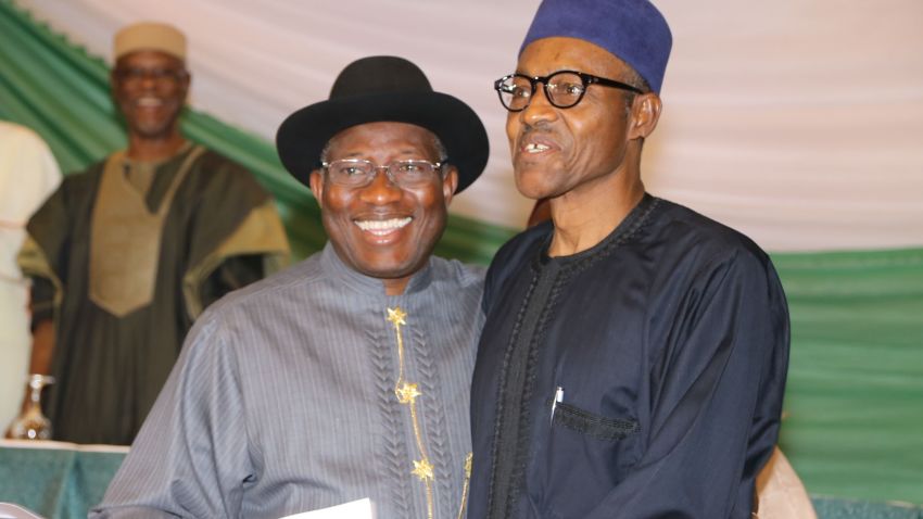 Caption:Nigerian President Goodluck Jonathan (L) and APC main opposition party's presidential candidate Mohammadu Buhari (R) smile after signing the renewal of the pledges for peaceful elections on March 26, 2015 in Abuja. Security is a major concern at Saturday's vote both from Boko Haram violence against voters and polling stations to clashes between rival supporters. In 2011, around 1,000 people were killed in violence after Jonathan beat Buhari to the presidency. AFP PHOTO / PHILIP OJISUA (Photo credit should read PHILIP OJISUA/AFP/Getty Images)