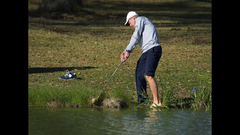 Peter Malnati hits a shot along the water's edge Friday, March 27, during the second round of the Chitimacha Louisiana Open. The tournament, part of the Web.com Tour, took place in Broussard, Louisiana.