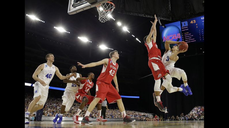 Duke's Grayson Allen tries to get a shot off as he's defended by Utah's Brekkott Chapman during an NCAA Tournament game in Houston on Friday, March 27.