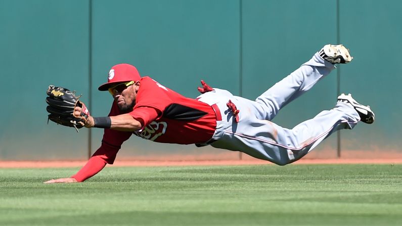 Billy Hamilton makes a diving catch for the Cincinnati Reds during a spring-training game Thursday, March 26, in Goodyear, Arizona.