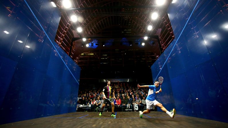 England's Peter Barker, right, plays a shot Thursday, March 26, during his semifinal match against Germany's Simon Rosner at the Canary Wharf Squash Classic in London. Rosner advanced to the final, which he lost to England's Nick Matthew.