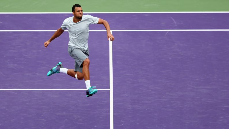 Jo-Wilfried Tsonga leaps in the air Saturday, March 28, after his three-set victory over Tim Smyczek in the second round of the Miami Open.