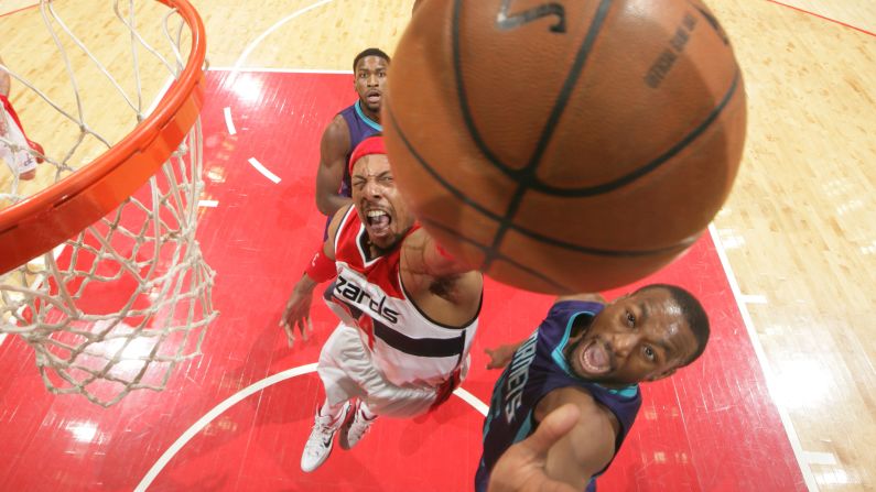 Paul Pierce of the Washington Wizards pulls down a rebound while playing against Kemba Walker, right, and the Charlotte Hornets on Friday, March 27.