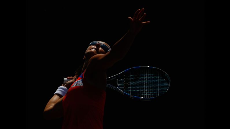 Kirsten Flipkens serves to Stefanie Voegele during a first-round match at the Miami Open on Wednesday, March 25.