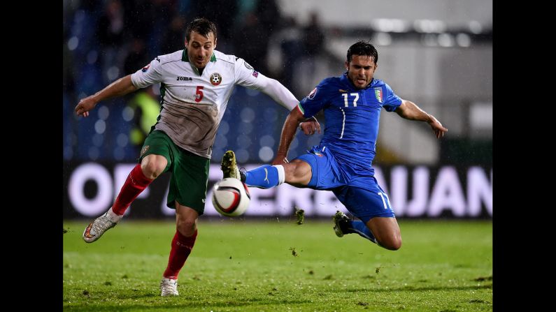 Bulgaria's Nikolay Bodurov, left, and Italy's Eder compete for the ball during a Euro 2016 qualifier Saturday, March 28, in Sofia, Bulgaria. Eder scored in the 84th minute to earn a 2-2 draw for the visitors.