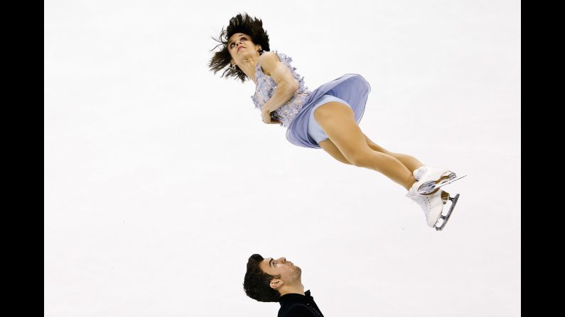 Canada's Meagan Duhamel and Eric Radford perform Wednesday, March 25, on their way to winning a gold medal at the World Figure Skating Championships.