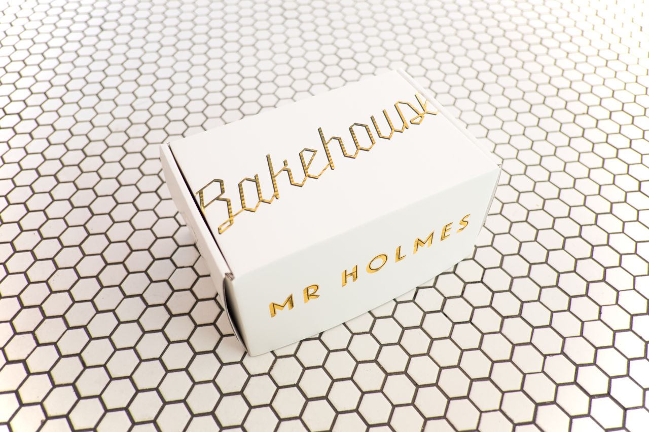 Mr. Holmes Bakehouse design and take-out boxes were inspired by the rich packaging from the fictional Mendl's Bakery in Wes Anderson's "The Grand Budapest Hotel."