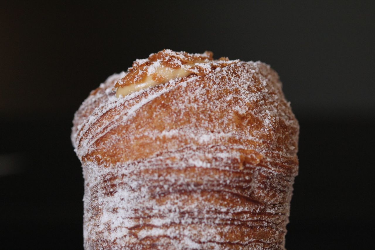 People have been lining up for 90 minutes or more to get a cruffin from Mr. Holmes Bakehouse in San Francisco. This work of art is filled with salted caramel cream, but flavors change daily. 