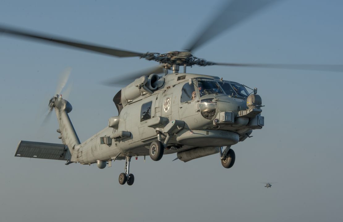 An MH-60R Sea Hawk helicopter approaches the flight deck of the aircraft carrier USS Carl Vinson in November 2014.