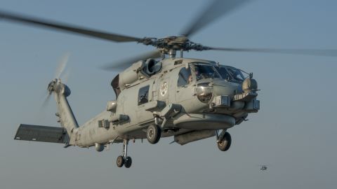 An MH-60R Sea Hawk helicopter approaches the flight deck of the aircraft carrier USS Carl Vinson in November 2014.