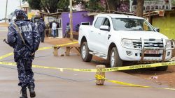 Police stand guard at the scene where acting assistant director of public prosecution Joan Kagezi was shot dead in a suburb in Kampala, on March 31, 2015. The State Attorney, who was handling the ongoing trial of 13 men accused of participating in 2010 Al-Shebab bombings that killed 76 people, was reportedly shot by two assailants who had been trailing her on a motorcycle. AFP PHOTO/ ISAAC KASAMANI (Photo credit should read ISAAC KASAMANI/AFP/Getty Images)