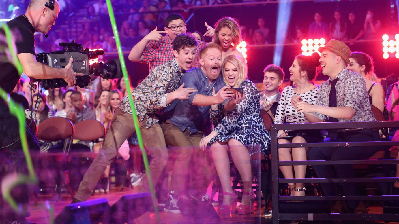 Actor Jesse Tyler Ferguson takes a photo with some of his "Modern Family" co-stars -- and singer Meghan Trainor, right -- at the Nickelodeon Kids' Choice Awards on Saturday, March 28. Behind Ferguson, from left, are actors Nolan Gould, Rico Rodriguez and Ariel Winter.