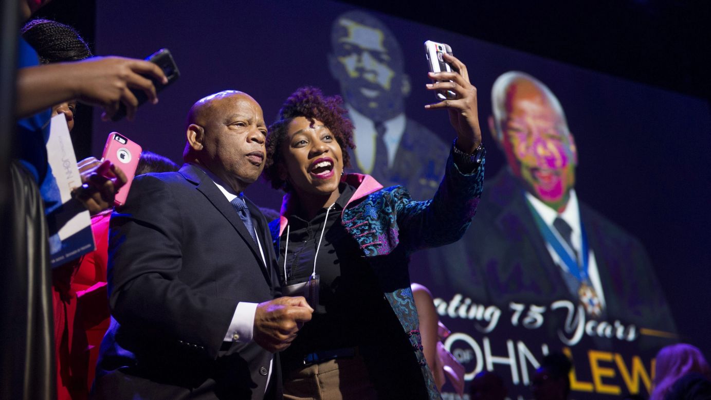 U.S. Rep. John Lewis poses for a selfie during a celebration held in his honor Saturday, March 28, in Atlanta. The civil rights icon turned 75 last month.