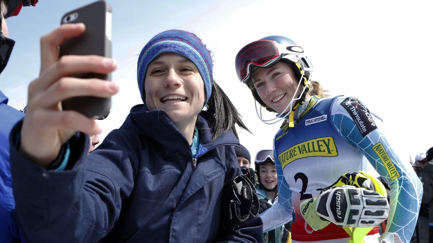 A teenager snaps a selfie with skier Mikaela Shiffrin on Saturday, March 28, after Shiffrin won the slalom race at the U.S. Alpine Championships in Carrabassett Valley, Maine.