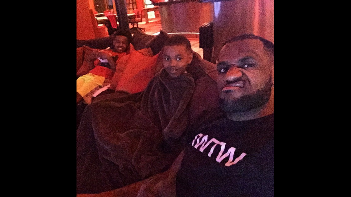 Basketball star LeBron James watches a movie with his children on Monday, March 30. "Movie night with these two crazies!" <a href="https://instagram.com/p/04GYDrCTIH/" target="_blank" target="_blank">he said on Instagram.</a> "We're watching a scary movie by the way! Crazy how certain things get passed down to your kids. Horror movies is one of them."