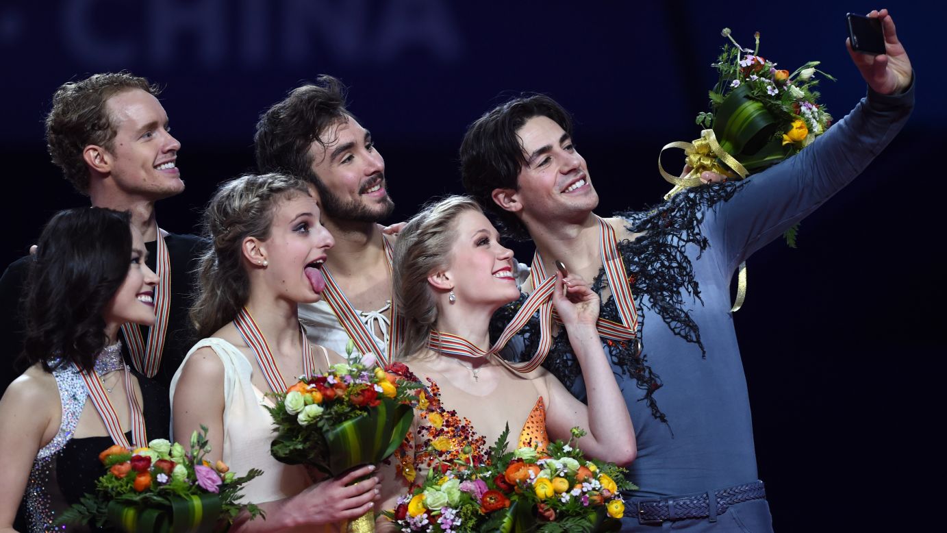 Ice dancers pose on a podium Friday, March 27, at the World Figure Skating Championships in Shanghai, China. From left to right are Madison Chock and Evan Bates of the United States, Gabriella Papadakis and Guillaume Cizeron of France, and Kaitlyn Weaver and Andrew Poje of Canada. The French duo won gold. The Americans finished second, while the Canadians finished third.