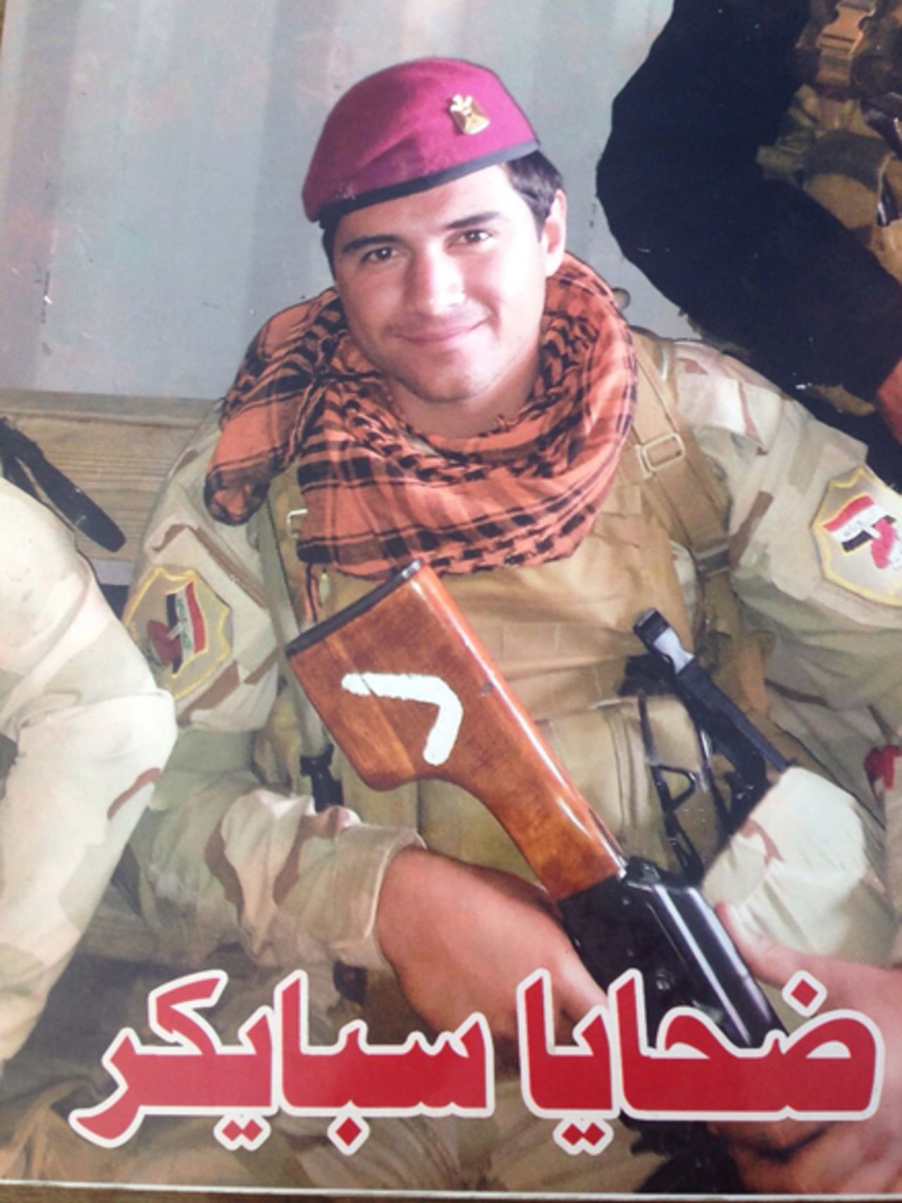Pictured is a close-up of the photograph of Imad. He joined the military 10 days before he was captured by ISIS. His family do not know his fate.