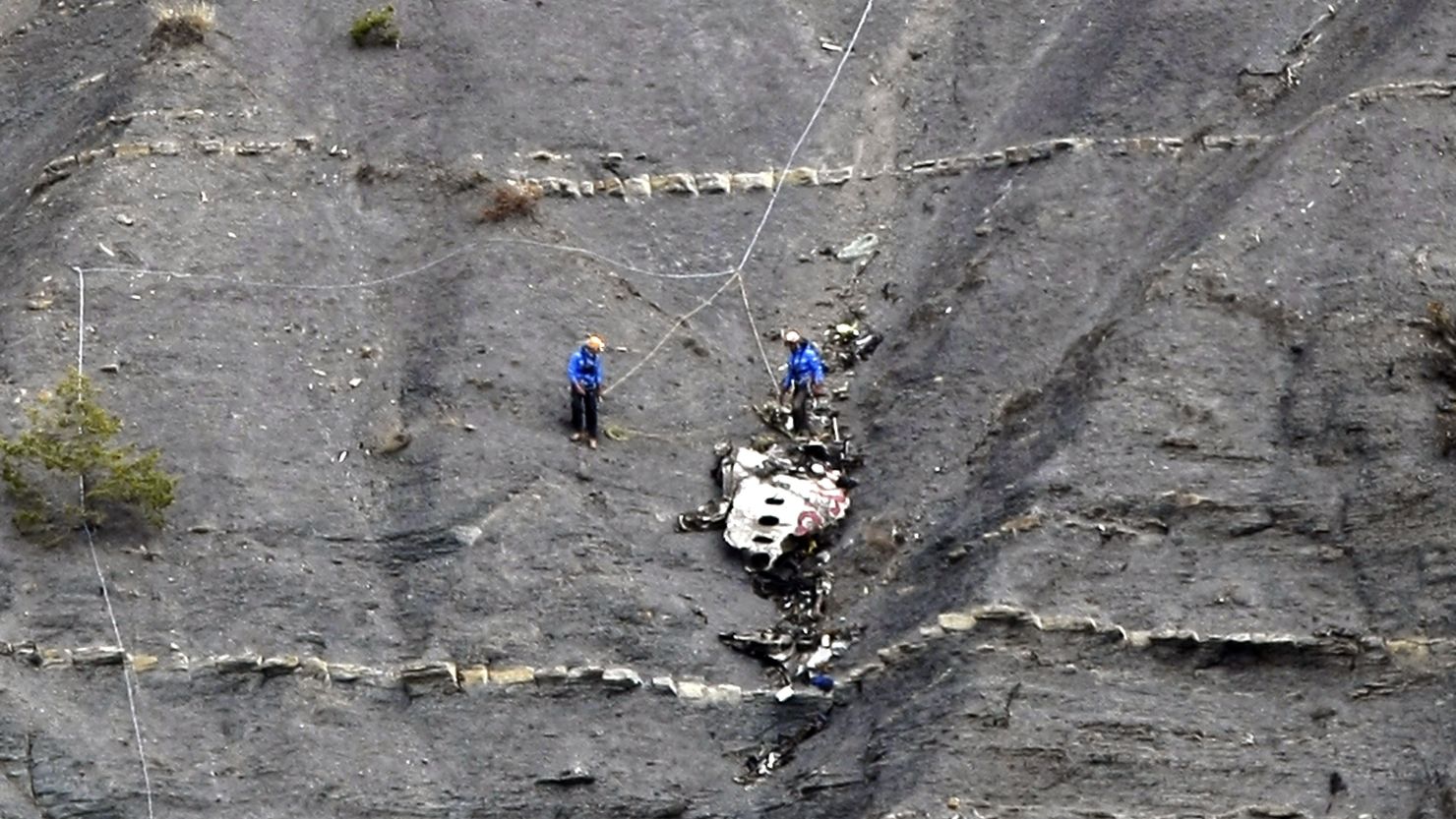 Workers recover items at the crash site of the Germanwings Airbus A320 near Seyne-les-Alpes, France, on March 30, 2015.
