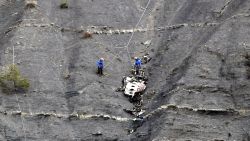 Members of the rescue team work at the crash site of the Germanwings Airbus A320 near Seyne-les-Alpes, France, on March 30, 2015. European investigators are focusing on the psychological state of a 27-year-old German co-pilot who prosecutors say deliberately flew a Germanwings plane carrying 150 people into a mountain, a French police official said on March 30. AFP PHOTO / POOL / CLAUDE PARIS (Photo credit should read CLAUDE PARIS/AFP/Getty Images)