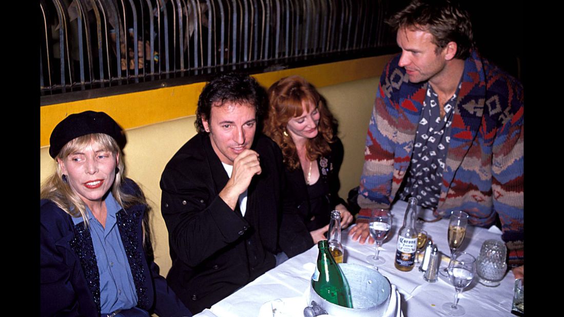 Mitchell, Bruce Springsteen, Patti Scialfa and Sting hang out at a post-concert party in 1991 in Los Angeles.