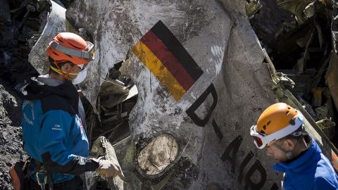 Gendarmes and rescuers from the Gendarmerie High-Mountain Rescue Group working at the crash site of the Germanwings Airbus A320 near Le Vernet, French Alps.