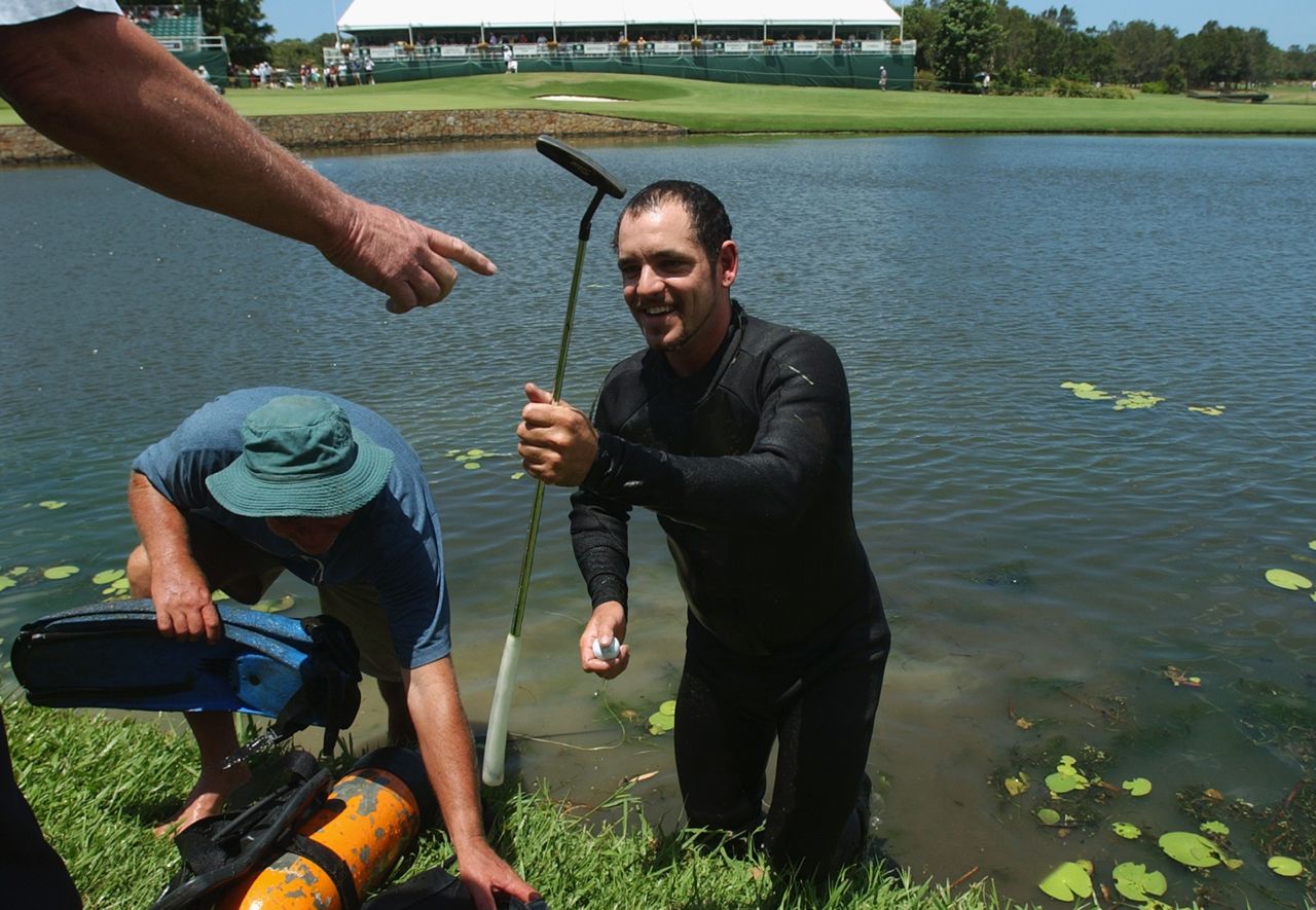 But golf balls aren't the only thing divers come across in the water. Here, a diver retrieves John Daly's putter and ball at the 2002 Australian PGA Championship in Queensland. 