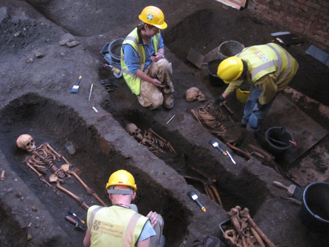Researchers excavate the cemetery site during refurbishment of the Old Divinity School.