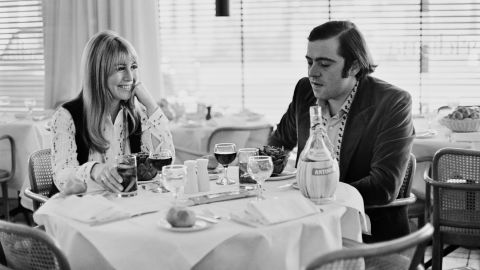 Lennon and Italian hotelier Roberto Bassanini dine together at a restaurant in 1969. They were married in 1970.