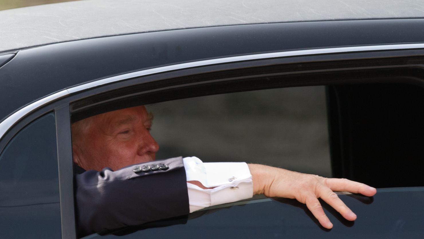 Donald Trump looks out the window of his limousine after visiting Newick's Lobster House on April 27, 2011 in Dover, New Hampshire.