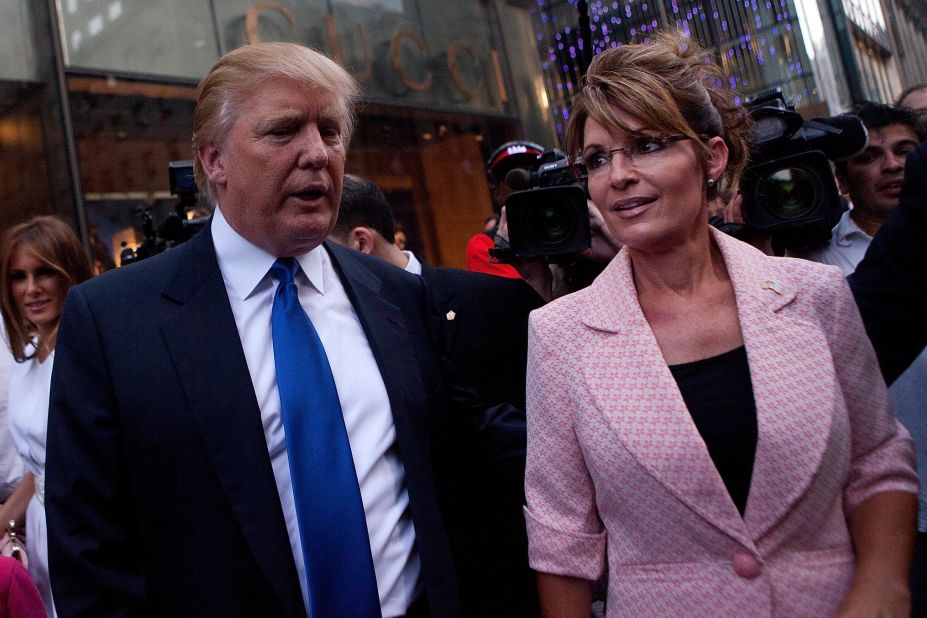 Former U.S. vice presidential candidate and Alaska Gov. Sarah Palin and Trump walk toward a limousine after leaving Trump Tower, at 56th Street and Fifth Avenue, on May 31, 2011, in New York City. 