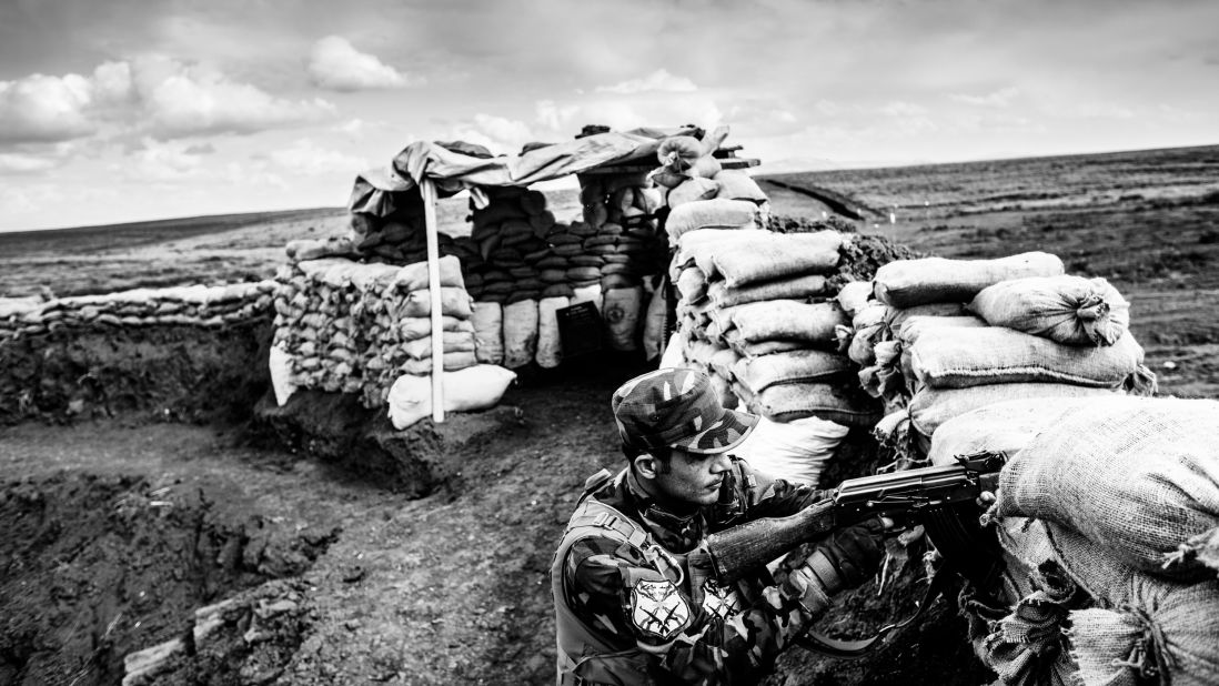 A militia fighter aims his weapon in Baqufa. So far, the militia has only assembled and trained 40 fighters, but they say they have many supporters who send money or offer support on the frontlines. 