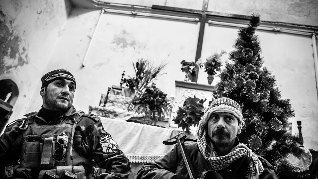 Dwekh Nawsha fighters inside a church in Baqufa. When the village was overrun by ISIS in August, they desecrated the church but left it intact as a structure.